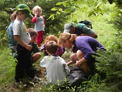 Naturalist Angela Gibbons takes a group on a nature walk on the property